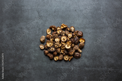Dried Shiitake mushrooms on a dark background