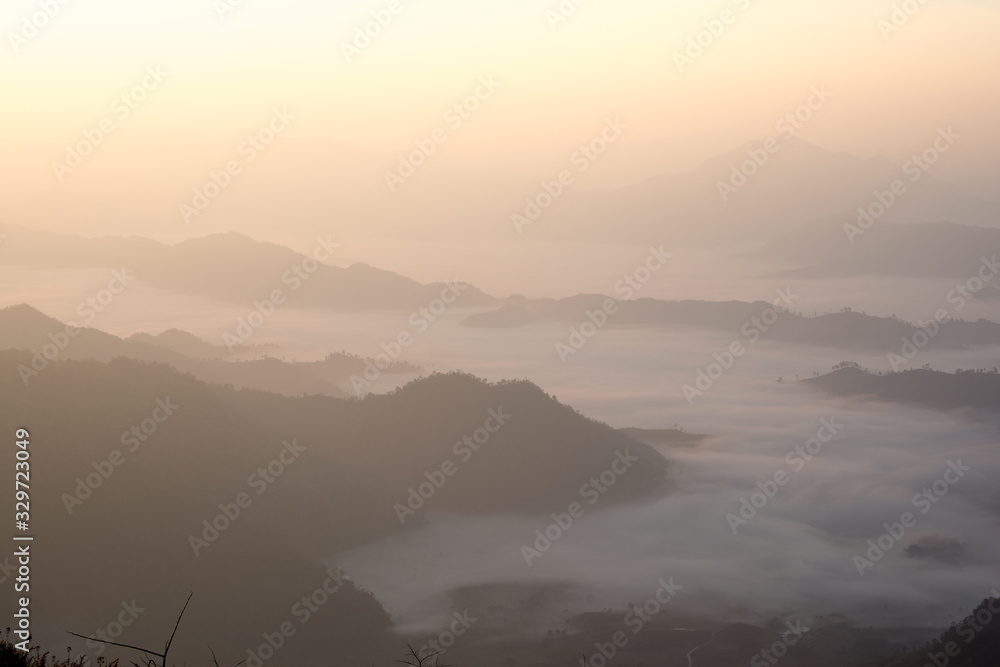 The scenery of Phu Chi Fah with sea of fog at sunrise time in Chiang Rai, Thailand.