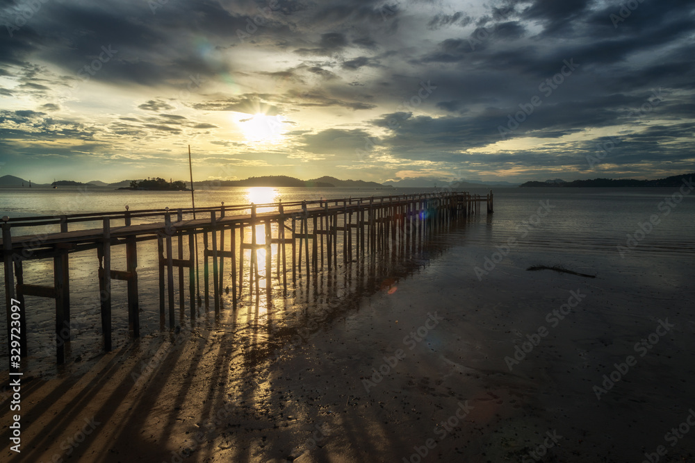 View of the wooden bridge in sunset time at Ranong, Thailand.