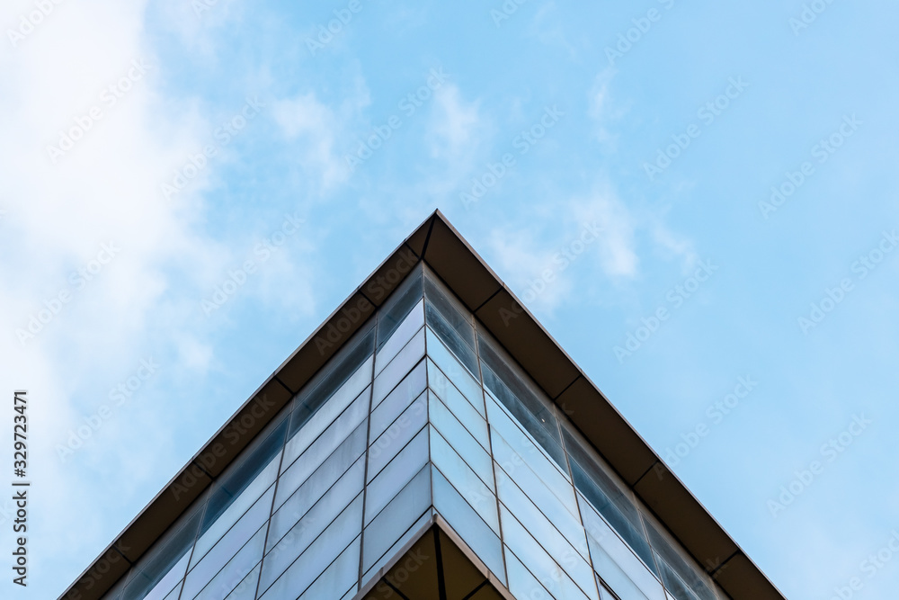 Bottom UP View Of A Corporate Building Against The Blue Sky Bottom UP View Of A Corporate Building Against The Blue Sky