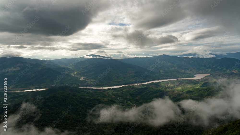 Beautiful view of Khong river and mountain layers from Pha Tang view point in Chiang Rai, Thailand. Beautiful view of Khong river and mountain layers from Pha Tang view point in Chiang Rai, Thailand.