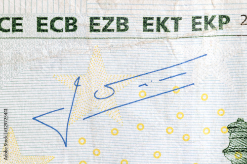 Jean-Claude Trichet's signature on 100 Euro banknote. Mario Draghi is president of the European Central Bank. photo
