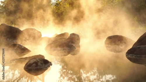 Hot Springs Onsen Natural Bath at National Park Chae Son, Lampang Thailand.In the morning sunrise.Natural hot spring bath surrounded by mountains in northern Thailand.