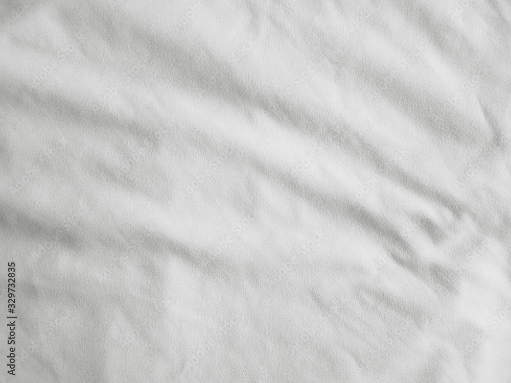 Soft white wrinkled fabric background Soft white wrinkled fabric background