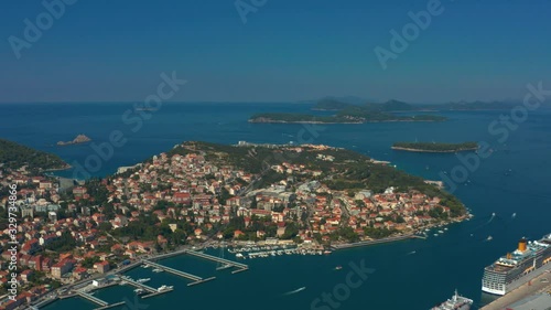 Descending aerial shot of Dubrovnik cruise ship terminal and parked ships, Croatia photo