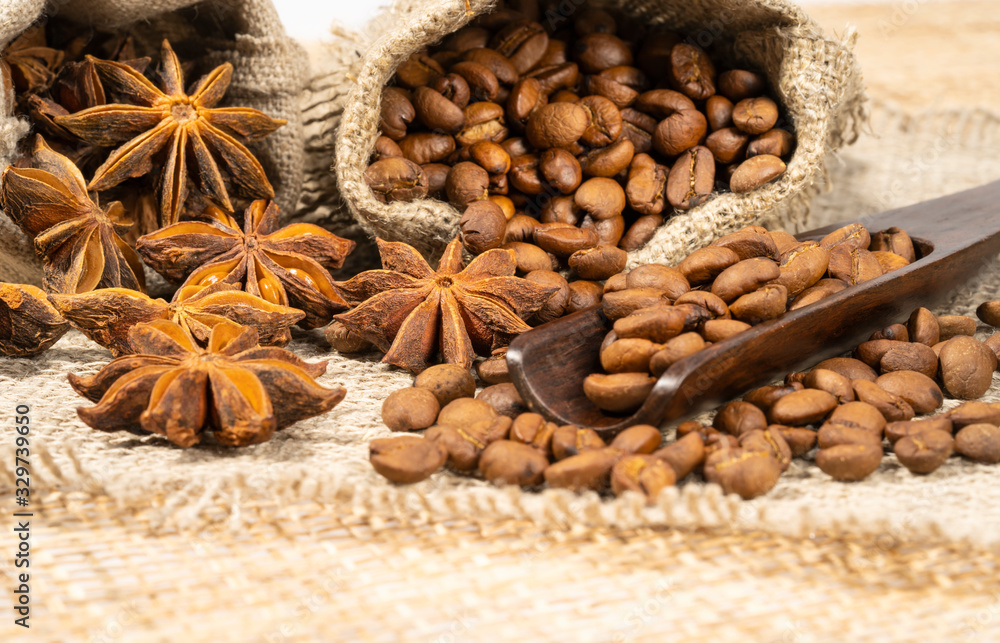 roasted coffee beans with cloth sack on wooden texture roasted coffee beans with cloth sack on wooden texture