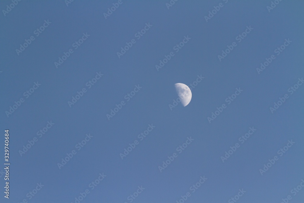 Glowing moon in sky background at dusk Glowing moon in sky background at dusk