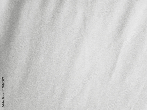 Soft white wrinkled fabric background