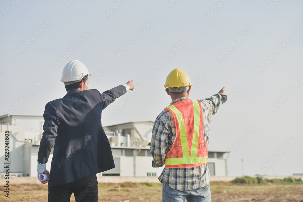 Two people businessman talking communication Architecture construction building project Two people businessman talking communication Architecture construction building project