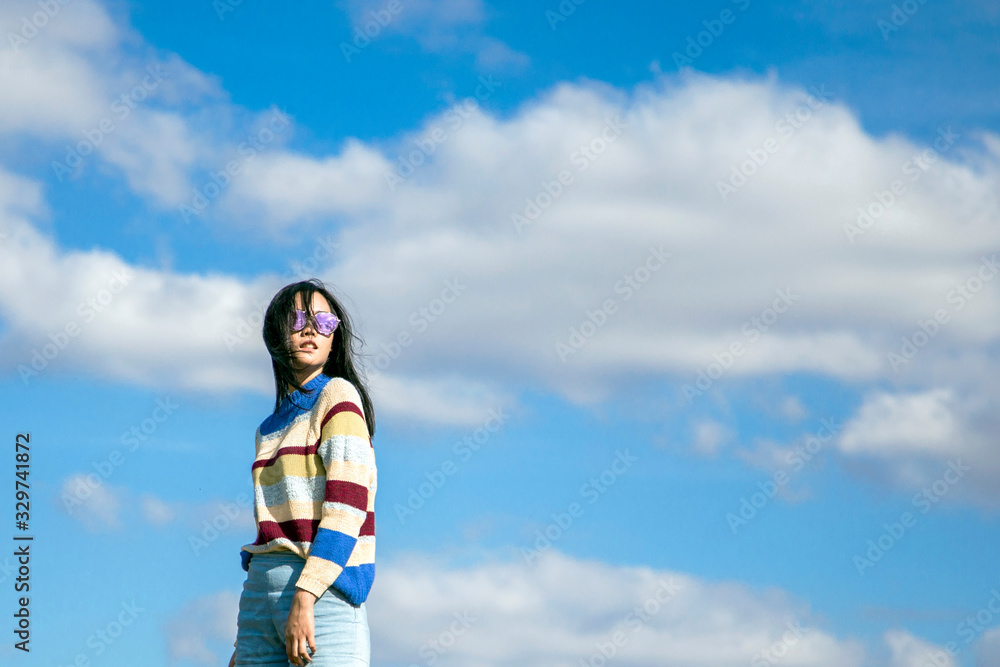 portrait asian girl relaxation on hill with sky