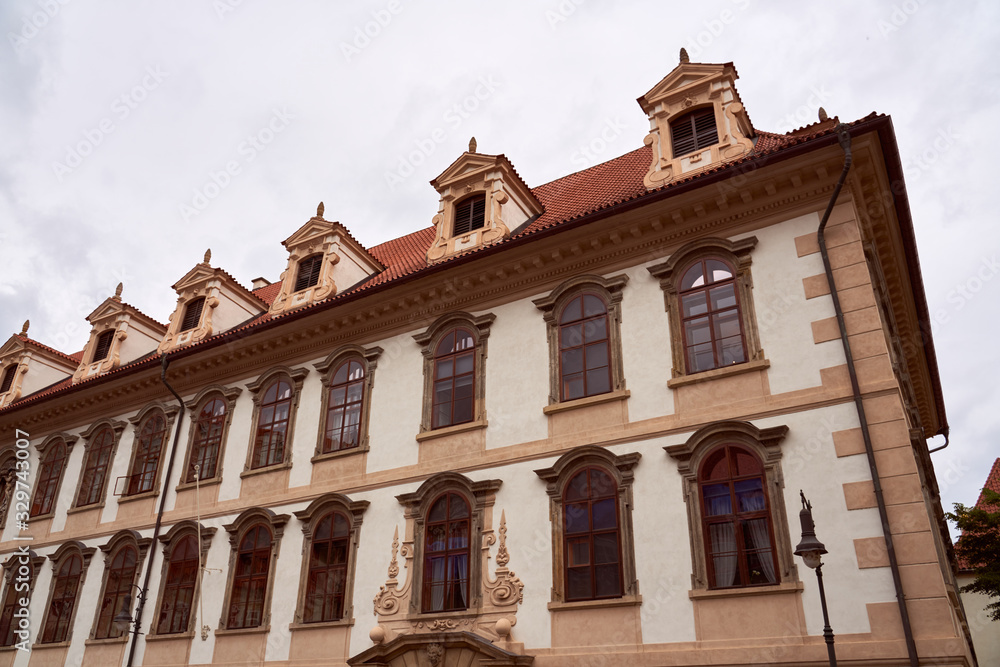 Obraz premium Prague cityscape with historic cityscape and the Prague castle. Horizontal photo of colorful European city of Prague in Czech Republic daytime, cloudy sky, month of may, travel in tourist place.