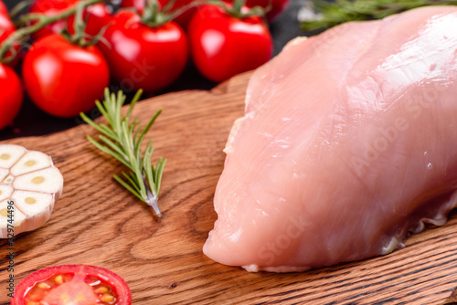 Fresh raw chicken fillet and vegetables prepared for cooking