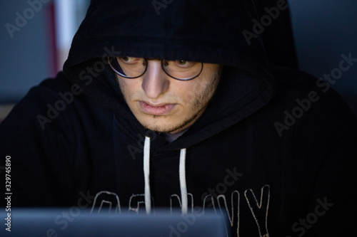 Картината върху платно Close-up of hacker penetrating network system