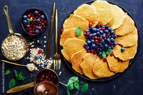 oatmeal pancakes on a plate with berries