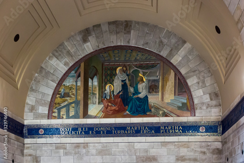 Bethany, Betania, Israel January 31, 2020: Church in Bethany in commemorating the home of Mari, Martha and Lazarus, Jesus' friends as well as the tomb of Lazarus.  Colorful mosaic in the church photo