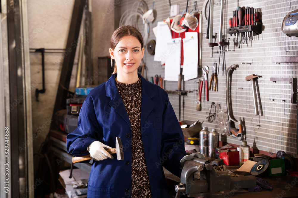 Workwoman in mechanical metalworking shop