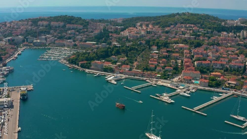 Pan and tilt aerial shot revealing the famous and amazing port of Dubrovnik, Croatia photo