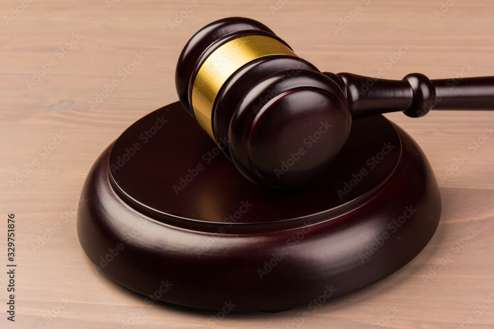 Wooden judges gavel on wooden table, close up. Space for text Wooden judges gavel on wooden table, close up. Space for text