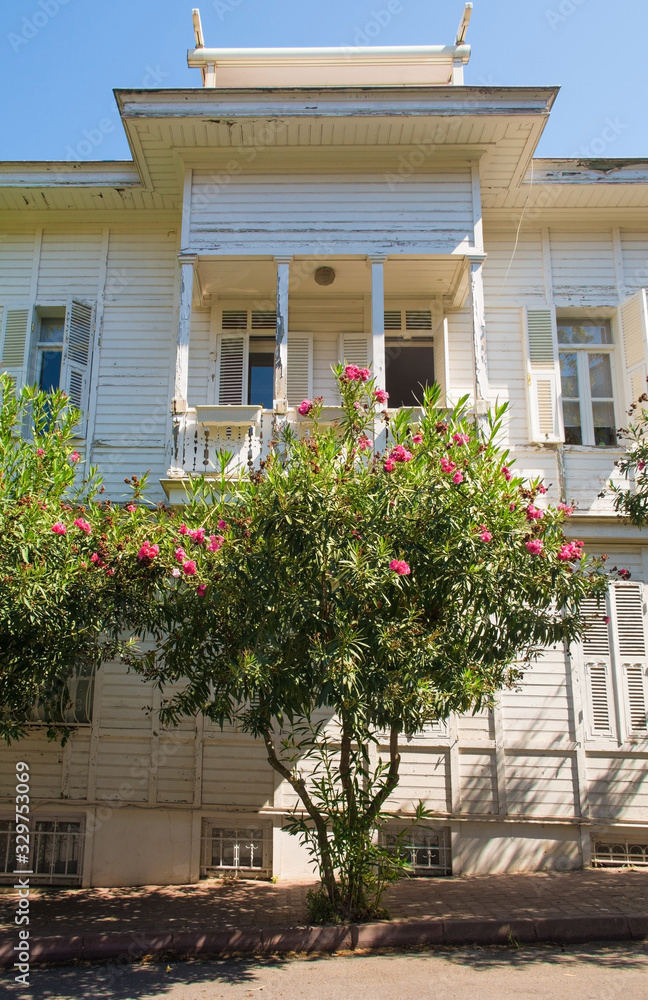 A traditional wooden house in a quiet residential street in Buyukada, one of the Princes' Islands, also known as Adalar, in the Sea of Marmara off the coast of Istanbul, Turkey. 