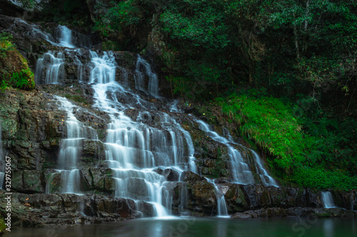 waterfall cover with green forest long exposure flat angle image