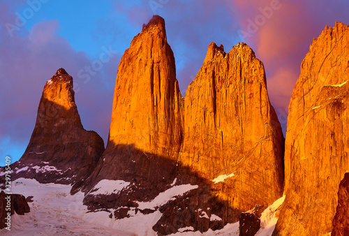 Towers of Paine at purple sunrise, Torres del Paine National Park, Patagonia, Chile.