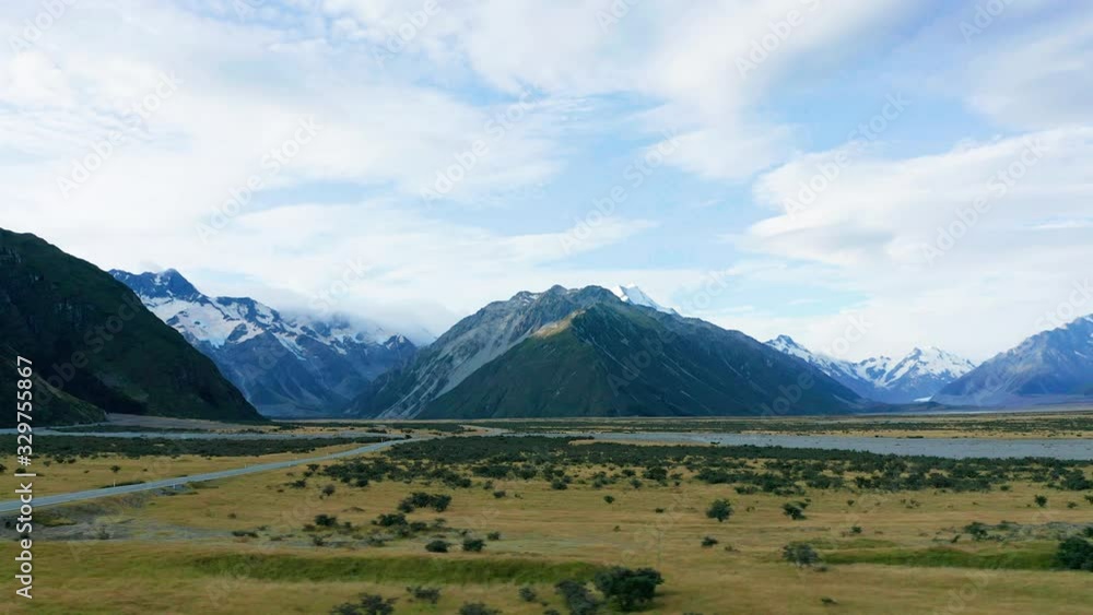 Amazing scenic windy road with mountains and glacier lake, aerial view. MT Cook State Highway 80, New Zealand.