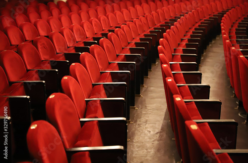 Classic rows of empty reddish seats in theatre © acceptfoto
