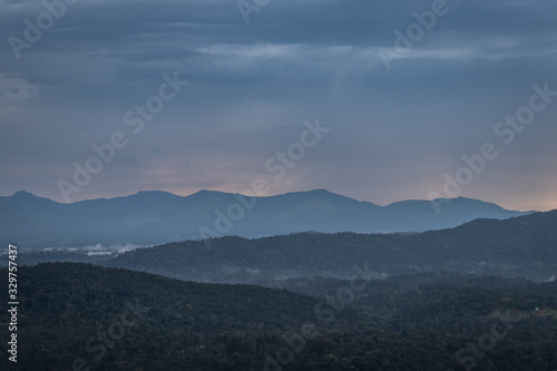 Misty mountains range with amazing sky photo