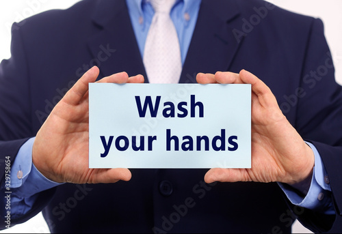 Business man hold empty paper wash your hand on it