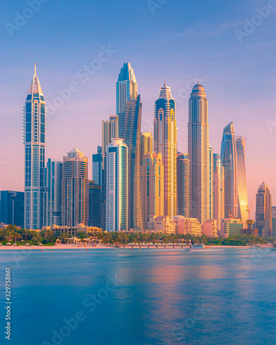 Photography Sunset view of high rise buildings and skyscrapers in Dubai Marina during golden