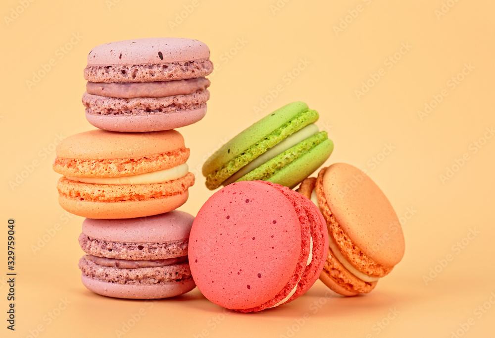 Sweet and colourful french macaroons on colored background Sweet and colourful french macaroons on colored background