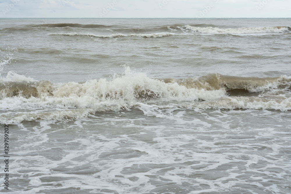 Roaring sea and dark raint clouds Roaring sea and dark raint clouds