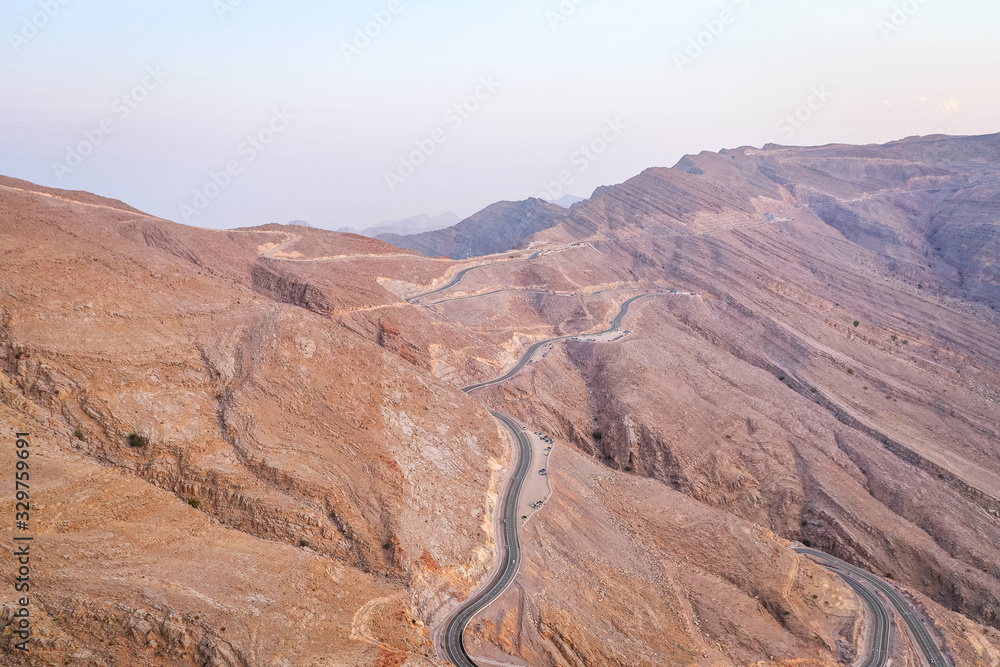 Naklejka premium Aerial view of mountain roads from the highest point in UAE at Jebel Jais in Ras Al Khaimah