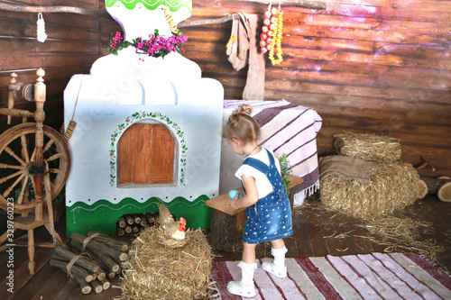 little cute girl with easter eggs and purse