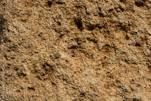 Beautiful shot of a textured floor of dried soil and dirt on a sunny day photo