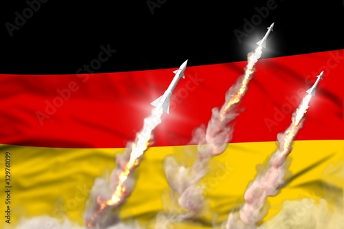 Modern strategic rocket forces concept on flag fabric background, Germany ballistic missile attack - military industrial 3D illustration, nuke with flag photo