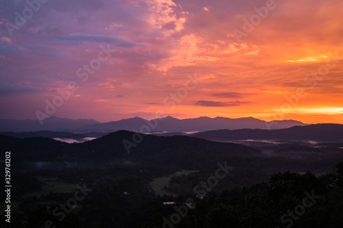 Misty mountains range with amazing sky