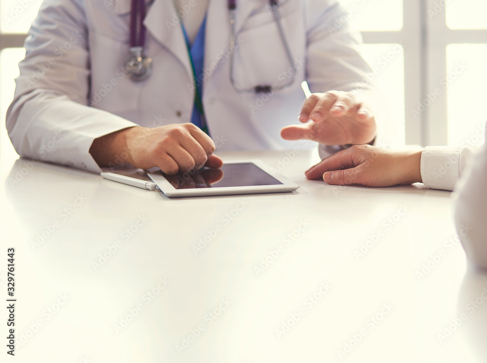 close up of patient and doctor prescribing medication close up of patient and doctor prescribing medication
