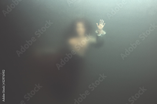 Fotografie siren woman swimming underwater behind glass surface, surreal concept