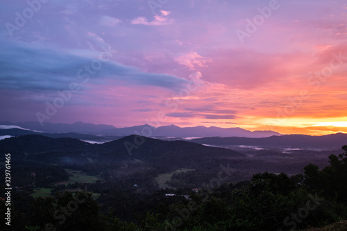 Misty mountains range with amazing sky photo