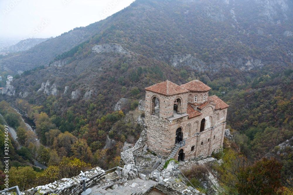 The Church of the Holy Mother of God in Asen's fortress. Old medieval fortress near Asenovgrad city. Plovdiv region, Bulgaria. Autumn landscape.
