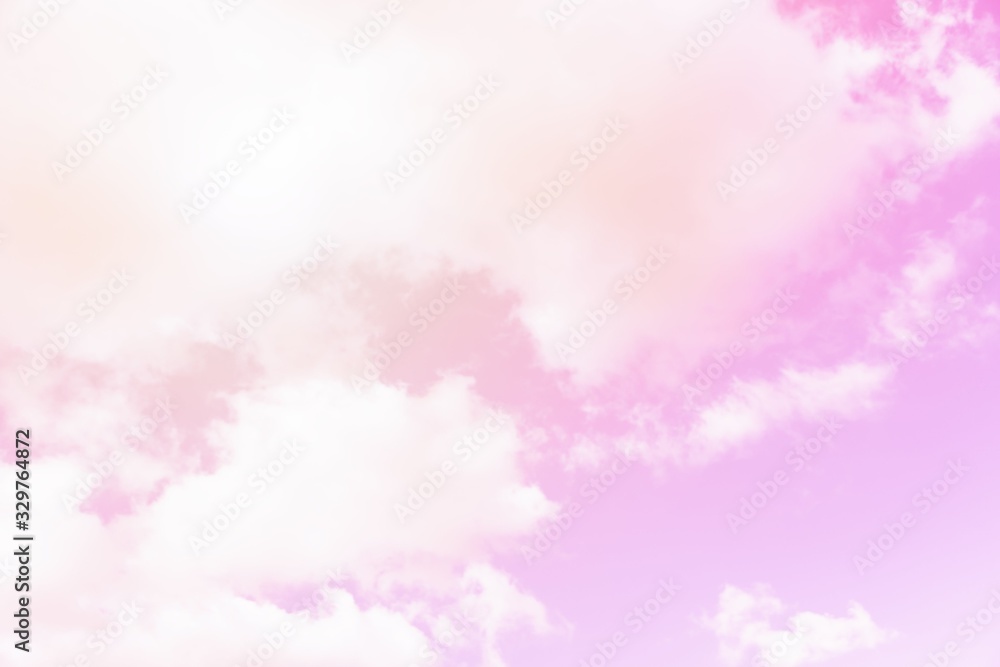Fototapeta premium Sunny pink sky background. Beautiful warm sky with clouds. Toned photo
