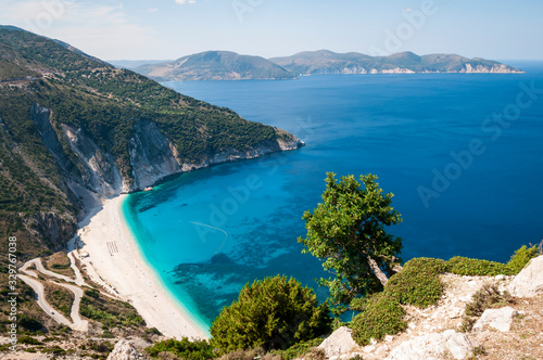 Bright sunny view from above of the Mediterranean shores of Myrtos Beach, on the Greek island of Kefalonia