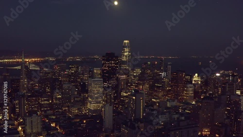 Wallpaper Mural Aerial, tilt up, drone shot overlooking downtown San Francisco cityscape, revealing the full moon, during night time, in California, United States Torontodigital.ca