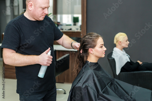Woman receiving haircut.