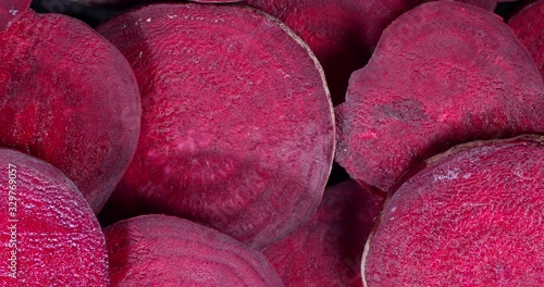 Rotating fresh beets slices . Top view.
