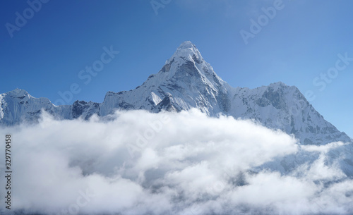 Ama Dablam 6814m clouds covered peak View near Dingboche settlement in Sagarmatha National Park, Nepal. Everest Base Camp (EBC) trekking route.