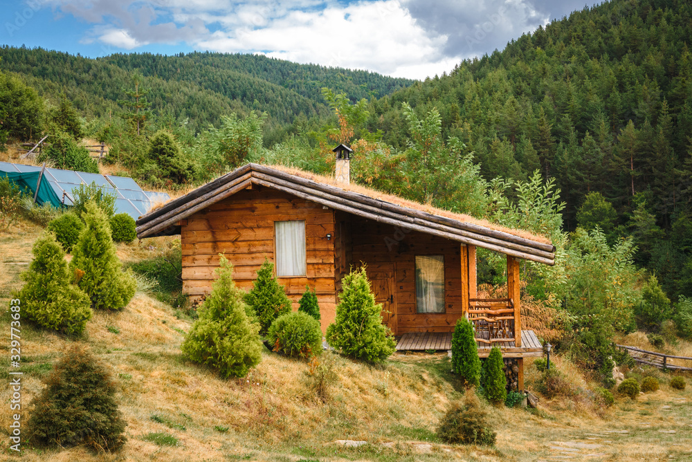 Small alpine style house in the forest. Small alpine style house in the forest.