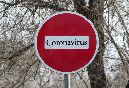 Stop sign on the street, it says "Coronavirus"