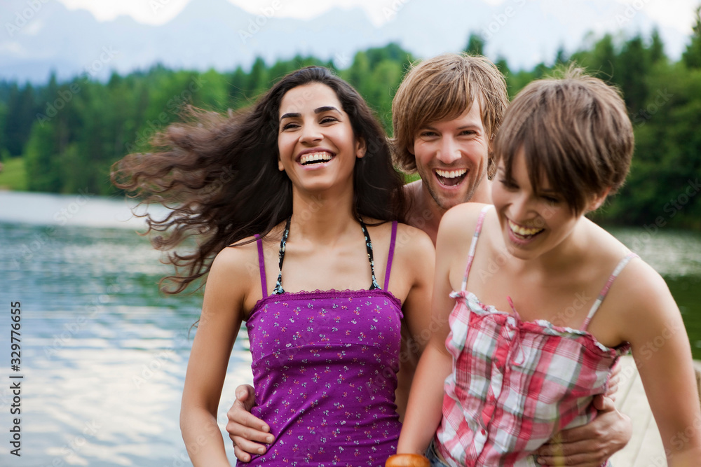 Friends having fun in summer at a mountain lake. Wallgau, Germany Friends having fun in summer at a mountain lake. Wallgau, Germany